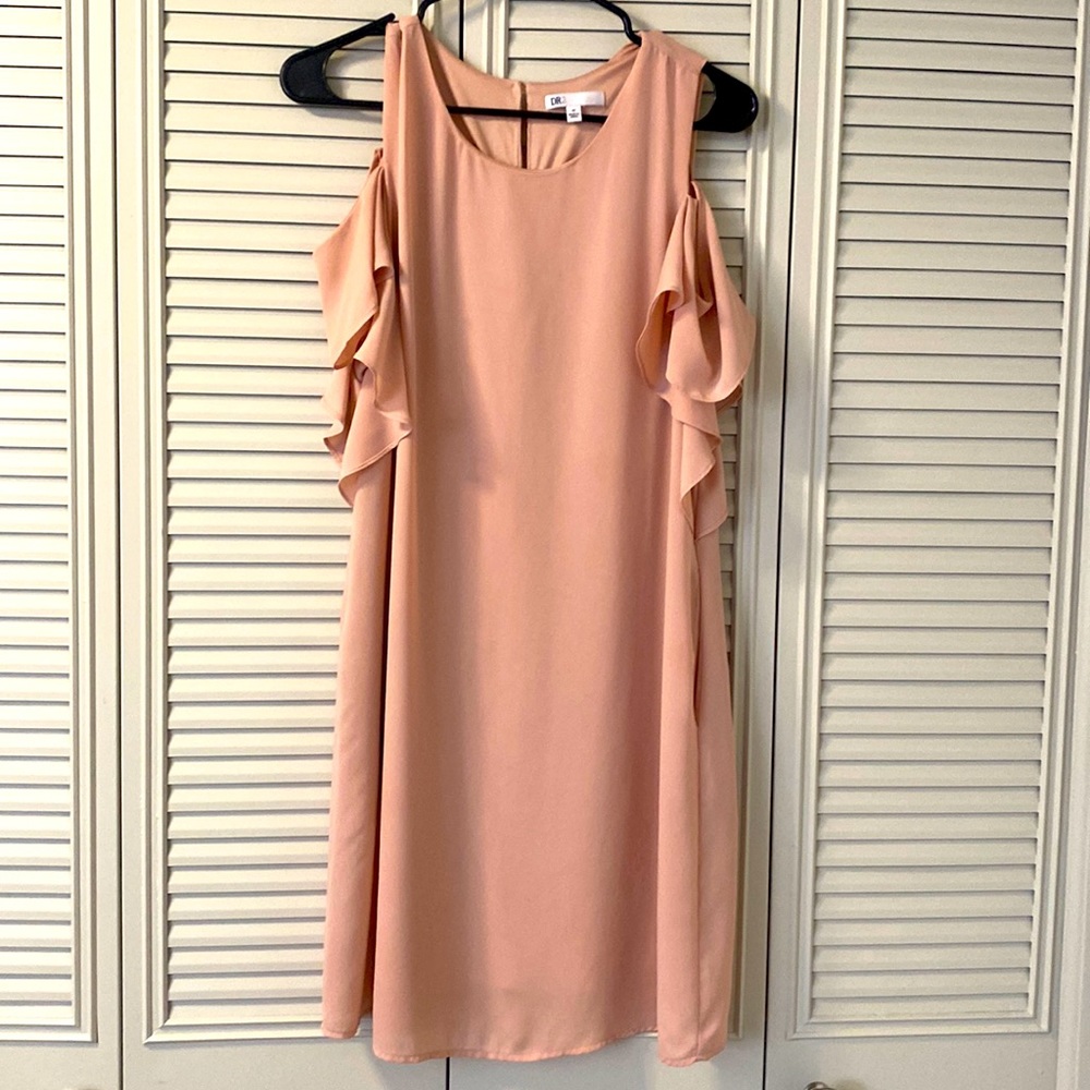 Pale pink, mid length, peek a boo shoulder dress with ruffle details and pockets